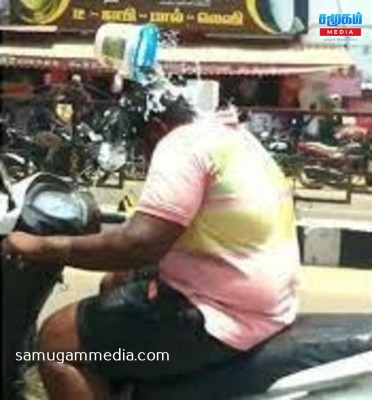 குளித்துக்கொண்டே இருசக்கர வாகனத்தை ஓட்டும் இளைஞன்! samugammedia 